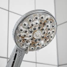 shower with build up from limescale in bathroom area