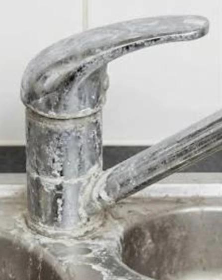 tap with build up from limescale in the bathroom area