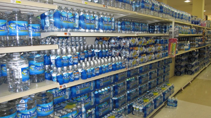 packs of bottled water in supermarket