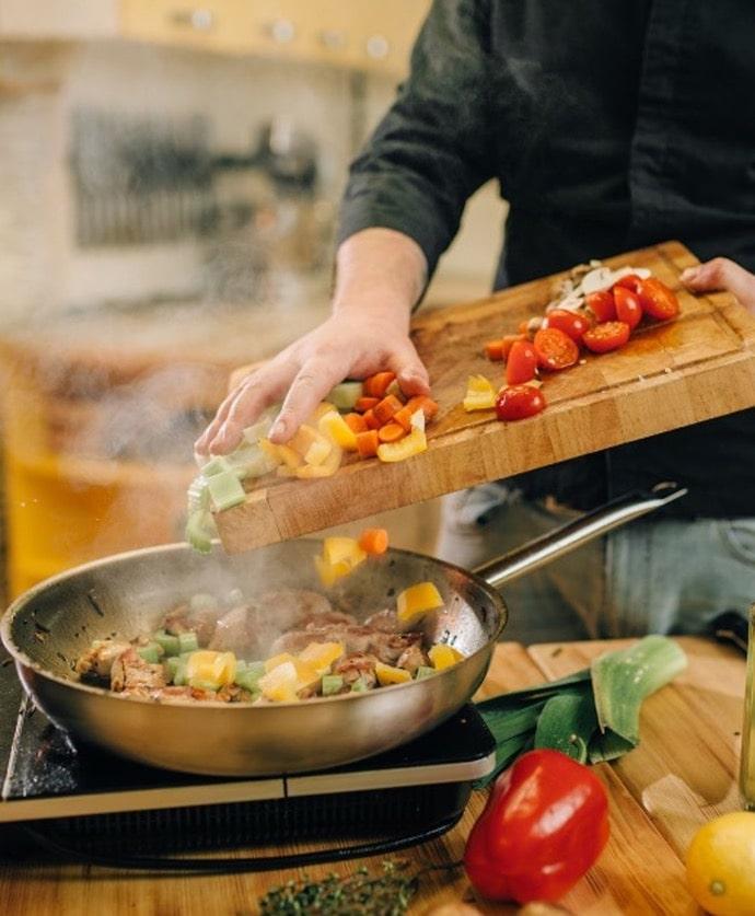 man cooking vegetable witha pan, healthy food