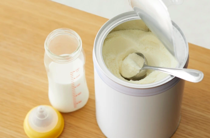 infant formula and milk bottle setup