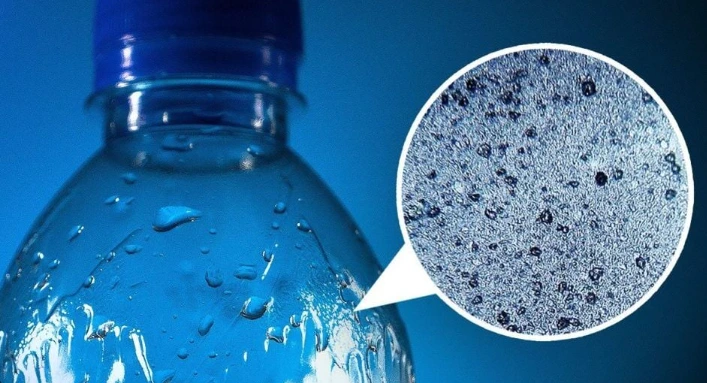microplastic, water bottled. microplatics microscope view on water bottled